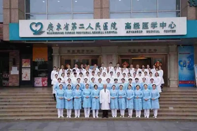A posed staff group outside the hospital’s Advanced Medical Center.