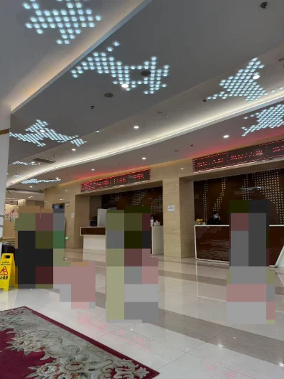 Reception area at Shanghai Ren’ai Hospital, with visitor details obscured.