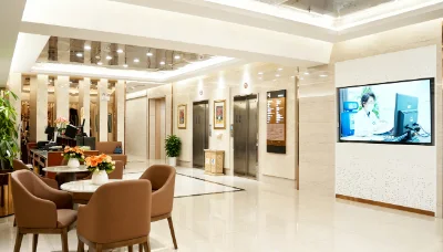 Hospital lobby with seating and elevator access.