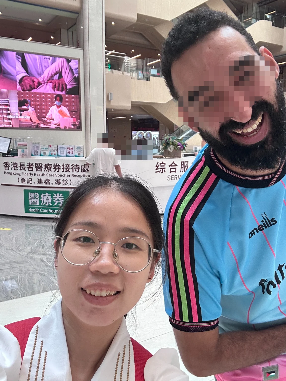 Omar with Lucy at Clifford Hospital; Omar’s face is obscured for privacy