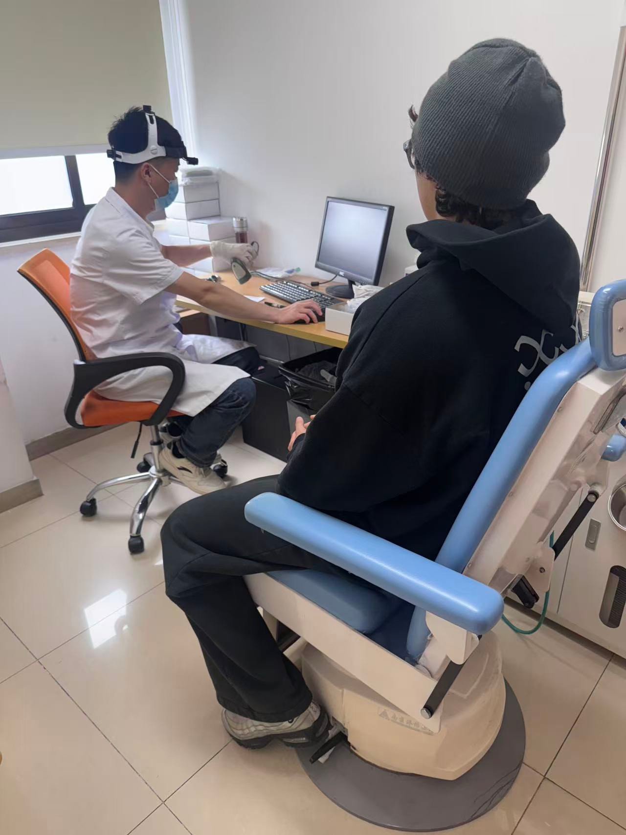 A hospital clinician and visitor during a department appointment