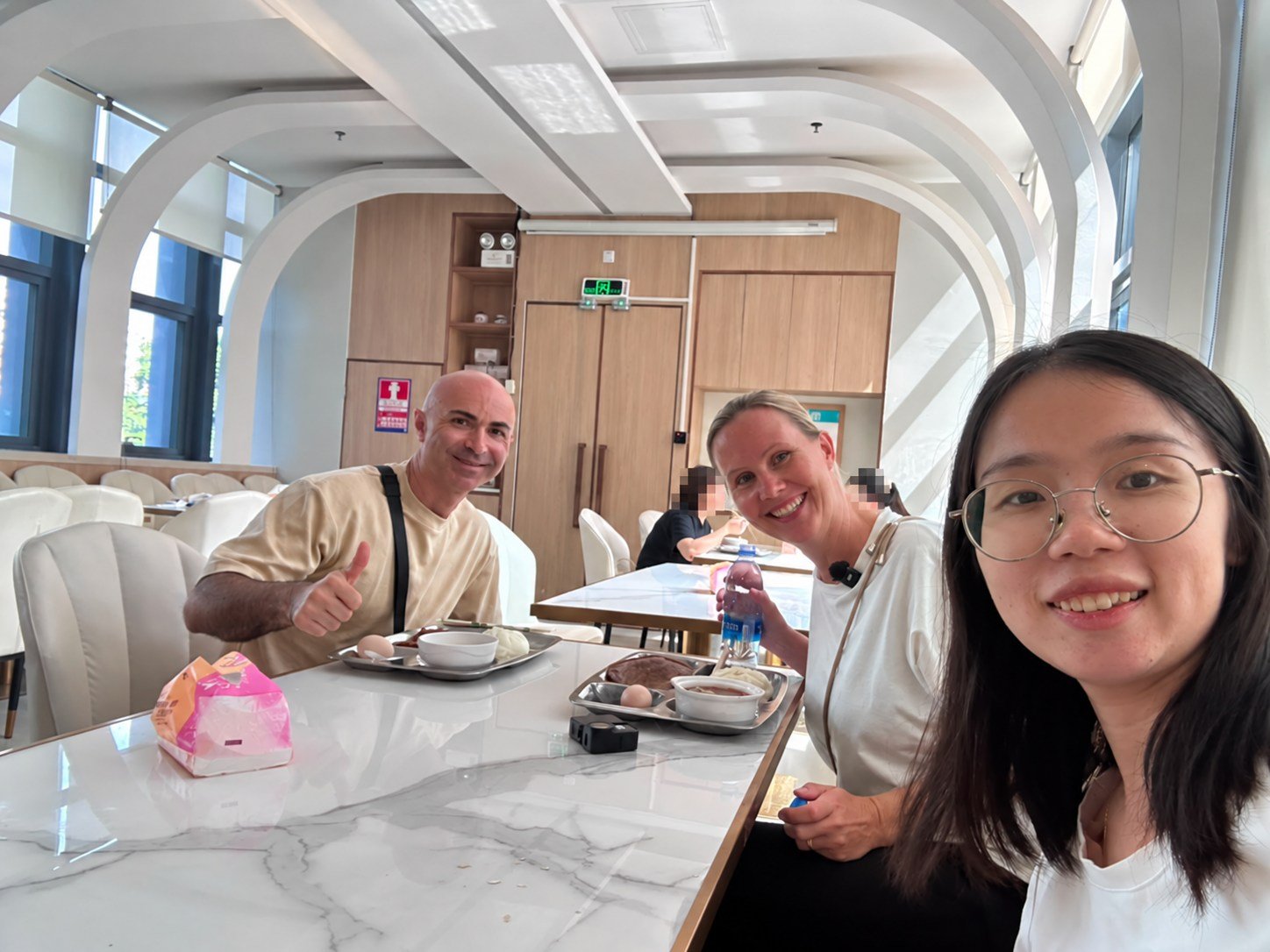 Alpay, Andrea and Lucy sharing a meal during the Shenzhen visit